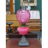 VICTORIAN OIL LAMP WITH CRANBERRY COLOURED RESERVOIR AND SHADE,