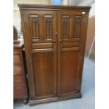 LINEN FOLD FRONTED OAK TWO DOOR SMALL WARDROBE