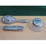 HALLMARKED SILVER AND GLASS DRESSING JAR AND TWO SILVER DRESSING BRUSHES (AT FAULT)