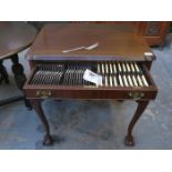 MAHOGANY TWO DRAWER CANTEEN ON BALL AND CLAW SUPPORTS CONTAINING MAPPIN & WEBB HALLMARKED SILVER