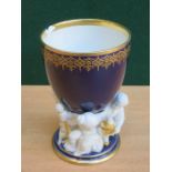 GERMAN GLAZED AND UNGLAZED GILDED CERAMIC GOBLET WITH FIGURE FORM DECORATION TO BASE, STAMPED KPM,