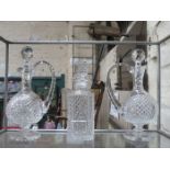 PAIR OF GLASS STEMMED WATERFORD CRYSTAL DECANTERS AND ONE OTHER DECANTER