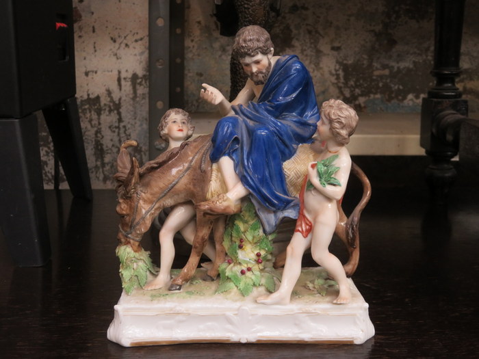 CONTINENTAL STYLE HANDPAINTED AND GILDED GROUP OF A GENT WITH TWO BOYS AND A DONKEY,