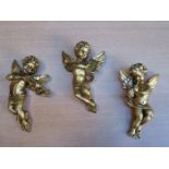 SET OF THREE GILDED PLASTER CHERUB WALL HANGINGS