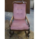 CARVED VICTORIAN MAHOGANY FRAMED AND UPHOLSTERED ROCKING CHAIR