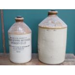 TWO STONEWARE ADVERTISING FLAGONS