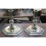 PAIR OF UNHALLMARKED WHITE METAL ANTIQUE CANDLESTICKS ON HEXAGONAL BASES