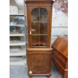 WALNUT VENEERED TWO DOOR GLAZED CORNER CUPBOARD