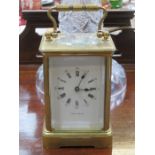 BRASS AND GLASS CARRIAGE CLOCK WITH ENAMELLED DIAL