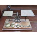 SET OF VINTAGE BRASS POSTAGE SCALES WITH SCALES ON WOODEN STAND BY BENETTFINK & CO,