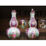 PAIR OF CONTINENTAL STYLE HANDPAINTED AND GILDED DOUBLE GOURD VASES AND COVERS,