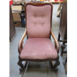 CARVED VICTORIAN MAHOGANY FRAMED AND UPHOLSTERED ROCKING CHAIR