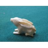 MINIATURE IVORY NETSUKE OF A HARE