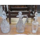 TWO EARLY GLASS DECANTERS AND EARLY CLARET JUG