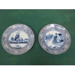 TWO DELFT STYLE CONTINENTAL BLUE AND WHITE CERAMIC PLATES (AT FAULT)