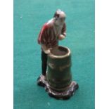 GLAZED POTTERY FIGURE DEPICTING AN ORIENTAL GENT WITH BARREL,