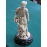 HEAVILY CARVED ANTIQUE SECTIONAL IVORY FIGURE DEPICTING AN ORIENTAL GENT ON TREEN STAND,