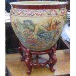 HANDPAINTED AND GILDED ORIENTAL STYLE CERAMIC FISH BOWL ON WOODEN STAND