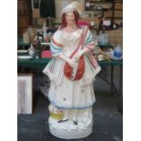 HANDPAINTED ANTIQUE STAFFORDSHIRE FIGURE OF A MUSICIAN,