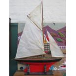 HANDPAINTED WOODEN YACHT, POSSIBLY BY THE START YACHT COMPANY, BIRKENHEAD, ON EBONISED STAND,