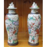 PAIR OF DECORATIVE POTTERY VASES WITH COVERS DECORATED WITH ORIENTAL SCENES,