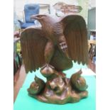 LARGE DECORATIVE TREEN CARVING DEPICTING AN EAGLE AND EAGLETS,