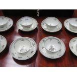 SET OF EIGHT EARLY HANDPAINTED CERAMIC TEA BOWLS AND SAUCERS