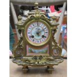 HIGHLY DECORATIVE GILT METAL FRENCH STYLE MANTEL CLOCK WITH HANDPAINTED AND ENAMELLED FACE AND