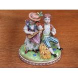 DRESDEN HANDPAINTED AND GILDED CERAMIC FIGURE GROUP DEPICTING A LADY AND GENT,