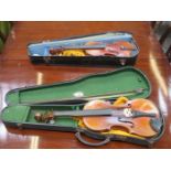 TWO CASED SCHOOLBOY VIOLINS WITH BOWS,