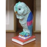 LARGE HEREND HANDPAINTED AND GILDED CERAMIC OWL, PERCHED ON TWO GRADUATED BOOKS,