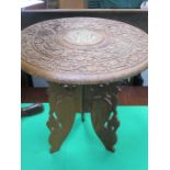 SMALL INDIAN STYLE CARVED AND PIERCEWORK DECORATED OCCASIONAL TABLE