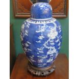 LARGE ORIENTAL BLUE AND WHITE PRUNUS PATTERN GINGER JAR WITH COVER ON TREEN SUPPORT (RESTORED),