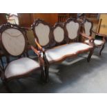 CARVED MAHOGANY VICTORIAN THREE SEATER CHAIR FORM SETTEE AND TWO SIMILAR CHAIRS,