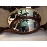 TWO OVAL WALL MIRRORS