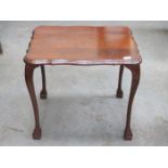 MAHOGANY SHAPED TOPPED OCCASIONAL TABLE ON BALL AND CLAW SUPPORTS