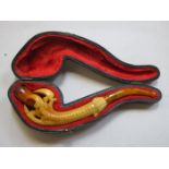 CASED CLAW FORM SMOKER'S PIPE WITH AMBER COLOURED MOUTH PIECE