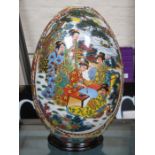 LARGE ORIENTAL CERAMIC EGG ON STAND,