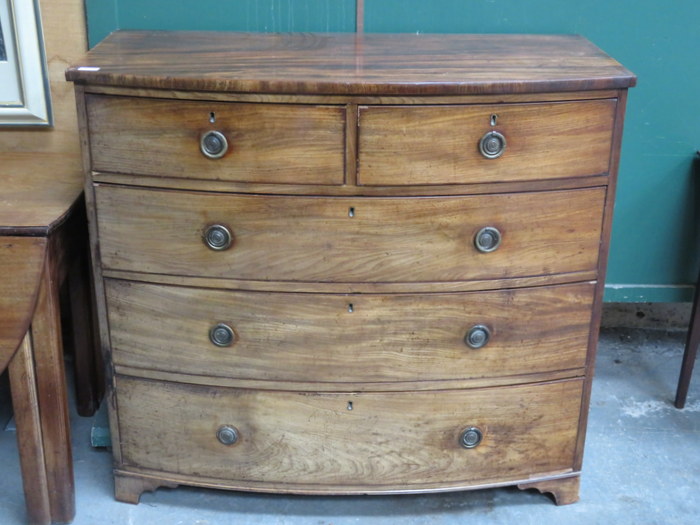 BOW FRONTED MAHOGANY TWO OVER THREE CHEST OF DRAWERS