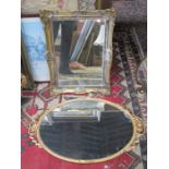 TWO GILDED OVAL WALL MIRRORS