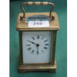 BRASS AND GLASS CASED FRENCH STYLE BRACKET CLOCK