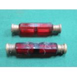 TWO ANTIQUE RUBY COLOURED GLASS DOUBLE PERFUME BOTTLES WITH HINGED COVERS