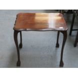 MAHOGANY SHAPED TOPPED OCCASIONAL TABLE ON BALL AND CLAW SUPPORTS