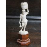 PRE-WAR 1930s INDIAN IVORY FIGURE DEPICTING A FRUIT CARRIER, MOUNTED ON STAND,