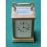 BRASS AND GLASS FRENCH STYLE CARRIAGE CLOCK WITH ENAMELLED DIAL
