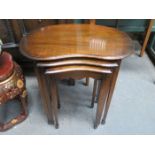 MAHOGANY KIDNEY SHAPED NEST OF THREE TABLES