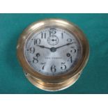 ANTIQUE BRASS CIRCULAR SHIPS CLOCK WITH SILVER COLOURED DIAL BY SETH THOMAS