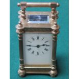 ORNATELY DECORATIVE BRASS AND GLASS CASED FRENCH STYLE CARRIAGE CLOCK