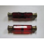 TWO ANTIQUE RUBY COLOURED GLASS DOUBLE PERFUME BOTTLES WITH HINGED COVERS