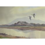 ARTHUR GEE FRAMED WATERCOLOUR DEPICTING A LAKESISDE SCENE WITH MALLARDS IN FLIGHT.